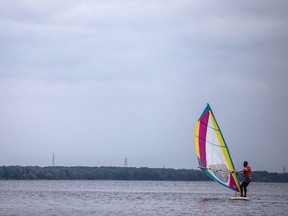 A man was out learning to windsurf on the Ottawa River by Petrie Island Beach, Saturday, June 26, 2021.