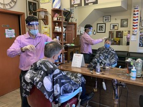 From the files: Mayor Jim Watson gets his hair cut at the Wellington Barber Shop, the last time the city was able to open hair salons and barber shops, many months ago. They can reopen again this Wednesday.