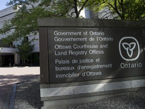 A file photo of signage near the courthouse on Elgin Street in Ottawa.