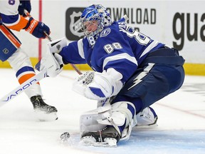 Andrei Vasilevskiy #88 of the Tampa Bay Lightning makes the save against Noah Dobson #8 of the New York Islanders during the second period in Game 5 of the Stanley Cup Semifinals during the 2021 Stanley Cup Playoffs at Amalie Arena on June 21, 2021 in Tampa, Florida.