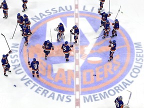 UNIONDALE, NEW YORK - JUNE 23:  The New York Islanders wave to the fans after their 3-2 overtime victory against the Tampa Bay Lightning in Game Six of the Stanley Cup Semifinals during the 2021 Stanley Cup Playoffs at Nassau Coliseum on June 23, 2021 in Uniondale, New York.