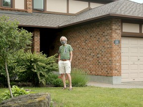 Tony Moren, who is under quarantine, is careful not to venture more than a few feet from his front door, instructing the photographer to stay on the road out of fear of "breaking the rules."