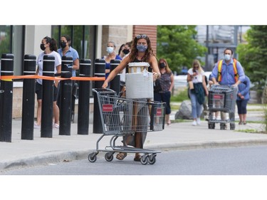 OTTAWA -- Shoppers lined up around the building to shop at a HomeSense store on Hazeldean Road on the first day of Stage 1 of the provincial reopening on Friday, Jun. 11, 2021 -- . ERROL MCGIHON, Postmedia