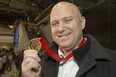 Ottawa 67's head coach André Tourigny shows off the gold he won at the 2020 world juniors as Team Canada assistant coach.