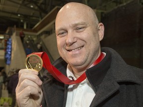 Ottawa 67's head coach André Tourigny shows off the gold he won at the 2020 world juniors as Team Canada assistant coach.
