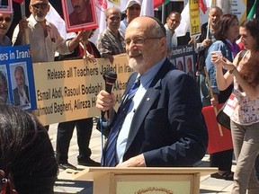 In this file shot, Rabbi Reuven Bulka speaks to a crowd of people demonstrating for freedom of Iranian teachers.