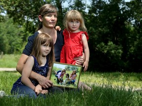 Samantha Hall - pictured here with her stepdaughter Ripley Lillico, 7, and daughter, Abigail Lillico, 3 in their country home's driveway. Hall was alone with her two girls and infant son when, she says, a Purolator driver hit their beloved dog Jake (pictured), on Easter Monday.