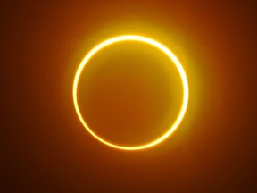 The moon moves in front of the sun in a rare "ring of fire" solar eclipse as seen from Balut Island, Saraggani province in the southern island of Mindanao on December 26, 2019.