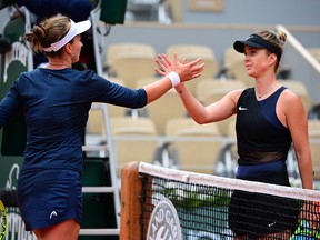 Ukraine's Elina Svitolina (R) and Czech Republic's Barbora Krejcikova shake hands at the end of their women's singles third round tennis match on Day 7 of The Roland Garros 2021 French Open tennis tournament in Paris on June 5, 2021. (Photo by MARTIN BUREAU / AFP) (Photo by MARTIN BUREAU/AFP via Getty Images)