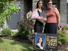 Grade 12 graduate Ava Civetta, left, and her mother Judy O’Brien arrive home after attending an outdoor graduation ceremony at École secondaire catholique Franco-Cité.
