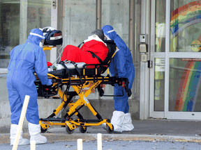 Ambulance attendants transport a resident from a seniors' long-term care home, amid the outbreak of COVID-19 in Laval, Quebec, April 16, 2020. Quebec "appeared to be the province that came closest to accurately and completely measuring the full magnitude of its COVID-19 fatalities," a new report says.