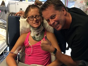 Casey with her father during recovery.