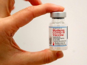 Files: A healthcare worker holds a vial of the Moderna COVID-19 vaccine