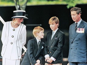 Prince Charles, Princess Diana and their children William (second, right) and Harry watch the commemorations of VJ Day on August 19, 1995.