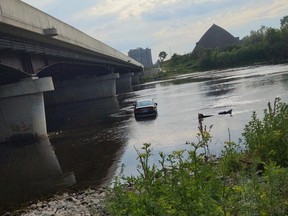 Honda Civic in the Rideau River. Driver not injured, faces several charges.  scenePosted by DisplacedandWonderin on reddit