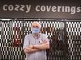 Ted Barkun, owner of Cozzy Coverings can't open because he doesn't have an exterior door.