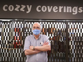 Ted Barkun, owner of Cozzy Coverings can't open because he doesn't have an exterior door.