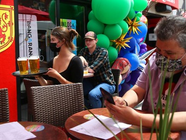 Rachel Sangster of Deacon Brodies Public House on Elgin St, delivers cold beers on the patio, June 11, 2021..



Assignment 135794

Jean Levac/Ottawa Citizen



ORG XMIT: 135794