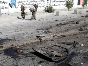 Afghan security forces inspect the site of a blast in Kabul, Afghanistan June 3, 2021. REUTERS/Stringer