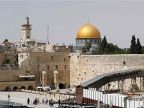 A picture taken on May 21, 2021, shows Jerusalem's Western Wall (R), the holiest site where Jews can pray, and the Dome of the Rock (C) mosque inside Islam's third holiest shrine, the Al-Aqsa mosque compound.
