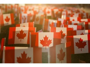 In this file photo taken on Nov. 10, 2020, miniature Canadian flags are seen outside Sunnybrook Hospital in Toronto ahead of Remembrance Day.