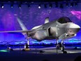 (FILES) This file photo taken on September 22, 2015 shows first Norwegian Armed Forces Lockheed Martin F-35A Lightning II, known as AM-1 Joint Strike Jet Fighter, unveiled during the rollout celebration at Lockheed Martin production facility in Fort Worth, TX, on Tuesday, Sep. 22, 2015. Switzerland's government on June 30, 2021 backed the purchase of 36 F-35A fighter jets from Lockheed Martin to replace its fleet and five Patriot air defence units from fellow US manufacturer Raytheon.