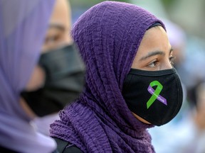 FILE: People attend a rally to highlight Islamophobia, sponsored by the Muslim Association of Canada, including the June 6 in London, Ontario attack which killed a Muslim family in what police describe as a hate-motivated crime, in Toronto, Ontario, Canada June 18, 2021.