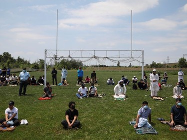 People wait before a funeral of the Afzaal family that was killed in what police describe as a hate-motivated attack, outside the Islamic Centre of Southwest Ontario, in London, Ontario, Canada June 12, 2021. REUTERS/Carlos Osorio ORG XMIT: GDN