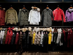 Files: Coats hang in the show room of the Canada Goose Inc. manufacturing facility in Toronto, Ontario, Canada, on Thursday, Feb. 27, 2014.