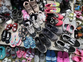 Children's shoes, toys, candy, tobacco and flowers have been left at memorials across the country to honour the 215 children buried at the former Kamloops residential school.