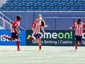 Atletico Ottawa players celebrate a second half goal against FC Edmonton on June 26, 2021.