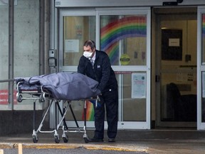A body is removed from the Centre d'hebergement de Sainte-Dorothee in Laval, Quebec.
