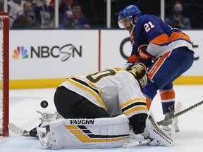 Islanders righ-winger Kyle Palmieri scores a goal against Bruins goalie Tuukka Rask during a game on Wednesday.