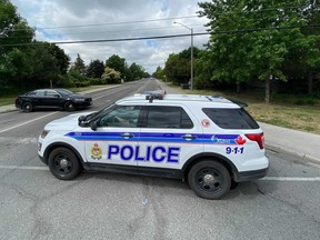 OTTAWA- June 14, 2021. Ottawa police blocking off Earl Mulligan and Woodpark Way in Barrhaven Monday morning due to a bear sighting. Tony Caldwell, Postmedia