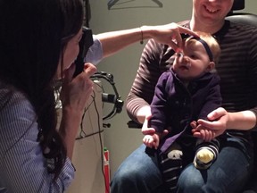 Patrick Monaghan's daughter's first eye exam (through OHIP) several years ago when she was six months old. The optometrist in the picture is Monaghan's colleague Dr. Lora Lee Hardy, at Barrhaven Optometric Centre.