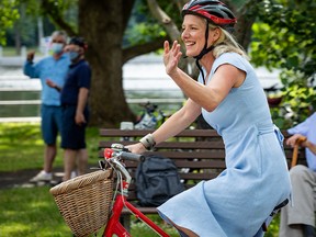 OTTAWA — The Honourable Catherine McKenna, Minister of Infrastructure and Communities and Member of Parliament for Ottawa-Centre, arrives on her bicycle to a press conference where she announced officially that she will not be running in the next election. Monday, Jun. 28, 2021.