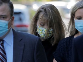 Actor Allison Mack, known for her role in the TV series 'Smallville', arrives with her lawyers to be sentenced for her part in NXIVM cult, at United States Federal Courthouse in Brooklyn, New York City, U.S., June 30, 2021.