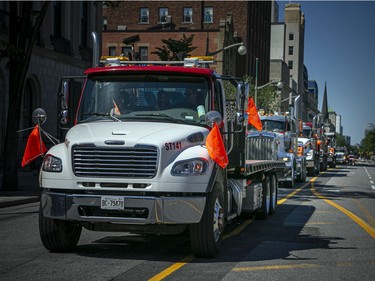 OTTAWA -- June 20, 2021 -- In recognition of the first 215 children discovered, a truck rally was held Sunday, June 20, 2021. The large group of trucks started at Thomas Cavanagh Construction in Ashton Station and made their way downtown, passing Parliament Hill Sunday morning. ASHLEY FRASER, POSTMEDIA