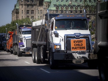 OTTAWA -- June 20, 2021 -- In recognition of the first 215 children discovered, a truck rally was held Sunday, June 20, 2021. The large group of trucks started at Thomas Cavanagh Construction in Ashton Station and made their way downtown, passing Parliament Hill Sunday morning. ASHLEY FRASER, POSTMEDIA