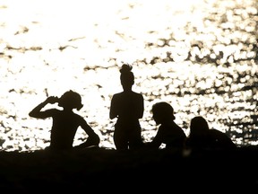 Beachgoers on English Bay Beach during a heatwave in Vancouver, British Columbia, Canada, on Monday, June 28, 2021. The heat is expected to continue for several days in some parts of British Columbia, according to weather warnings from the government.