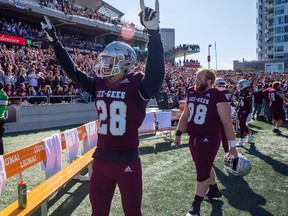 Alex Douglas celebrating a Panda Game victory for the Ottawa Gee-Gees.