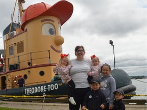Posing in front of Theodore Too in Prescott on Friday morning: in front, Korbin Connell and Kaiden Connell; back row, Mary Blair Polite, Taylor Polite, Isla Polite and Kendall Connell. The replica of Theodore Tugboat is scheduled to depart for Brockville on Saturday morning and dock in the city until Monday.