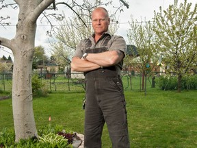 Mike Holmes stands on the lawn with trees. You can use your landscaping to create privacy, add functionality to your exterior and protect the outside of your home.
