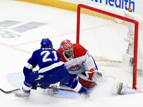 Carey Price of the Montreal Canadiens makes a save against a shot by Brayden Point of the Tampa Bay Lightning during the second period in Game 5 of the NHL Stanley Cup Final at Tampa's Amalie Arena on Wednesday July 7, 2021.