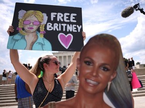 WASHINGTON, DC - JULY 14: Supporters of pop star Britney Spears participate in a Free Britney rally at the Lincoln memorial on July 14, 2021 in Washington, DC. The group is calling for an end to the 13-year conservatorship lead by the pop star's father, Jamie Spears and Jodi Montgomery, who have control over her finances and business dealings. Planned co-conservator Bessemer Trust is petitioning the court to resign from its position after Britney Spears spoke out in court about the conservatorship.