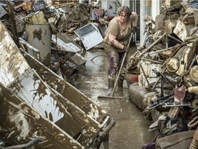 BAD NEUENAHR, GERMANY - JULY 18: Volunteers and residents start the clean up process at their shops and restaurants following severe flash flooding on July 18, 2021 in Bad Neuenahr-Ahrweiler, Germany.