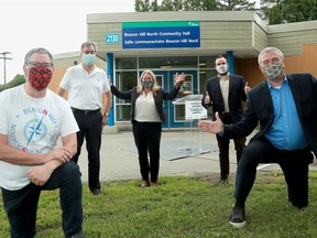 City, provincial and federal government representatives gathered at Beacon Hill North Community Hall on Friday to announce new funding for repairs and upgrades to municipal infrastructure, including (from left:) Beacon Hill Community Association president Jeff Kaluski, Ottawa Mayor Jim Watson, MP Mona Fortier, MPP Jeremy Roberts and city councillor Tim Tierney.