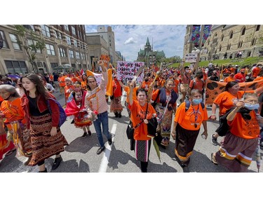 Thousands marched to Parliament Hill on Thursday in memory of residential school victims.