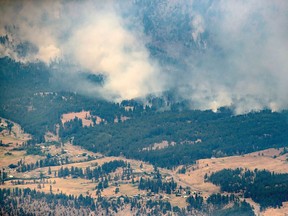 A wildfire burns in the mountains north of Lytton, B.C., on Thursday, July 1, 2021.