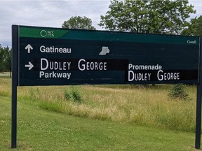 Dudley George sign Thursday on Island Park Drive leading to current Sir John A Macdonald Parkway. The sign was later removed.